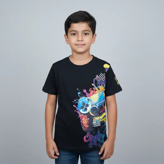 Child wearing a black t-shirt with colorful graphics on a gray background