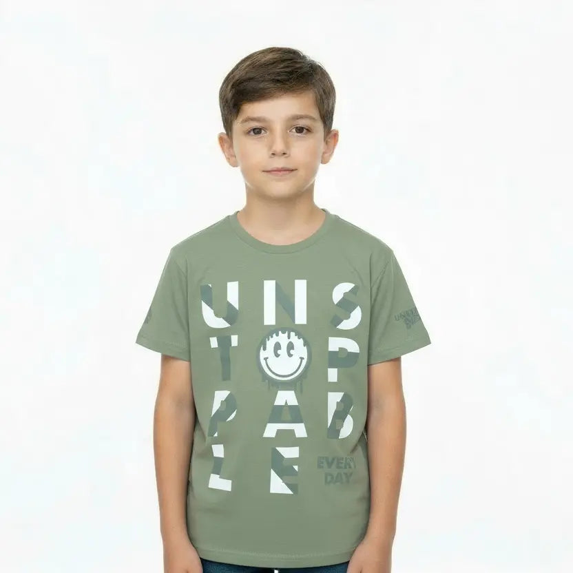 Child wearing a green t-shirt with text and smiley face on a white background