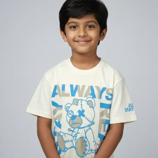 Child wearing a white t-shirt with a bear graphic and 'ALWAYS' text on a plain background
