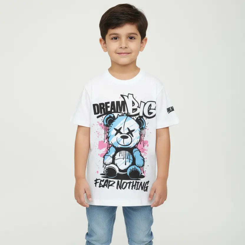 Child wearing a white t-shirt with a teddy bear graphic and text on a plain background